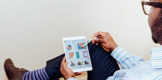 Innovations and trends: How AI is improving predictive analytics Man checking social media analytics